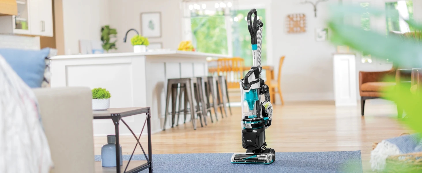 Vacuum in kitchen on hardwood floor